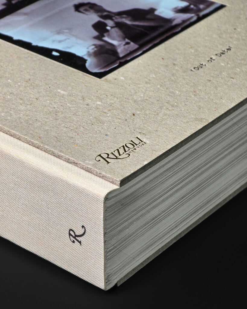 Close-up of the raw board cover, cloth spine and book block of Mark Borthwick Out of Date.