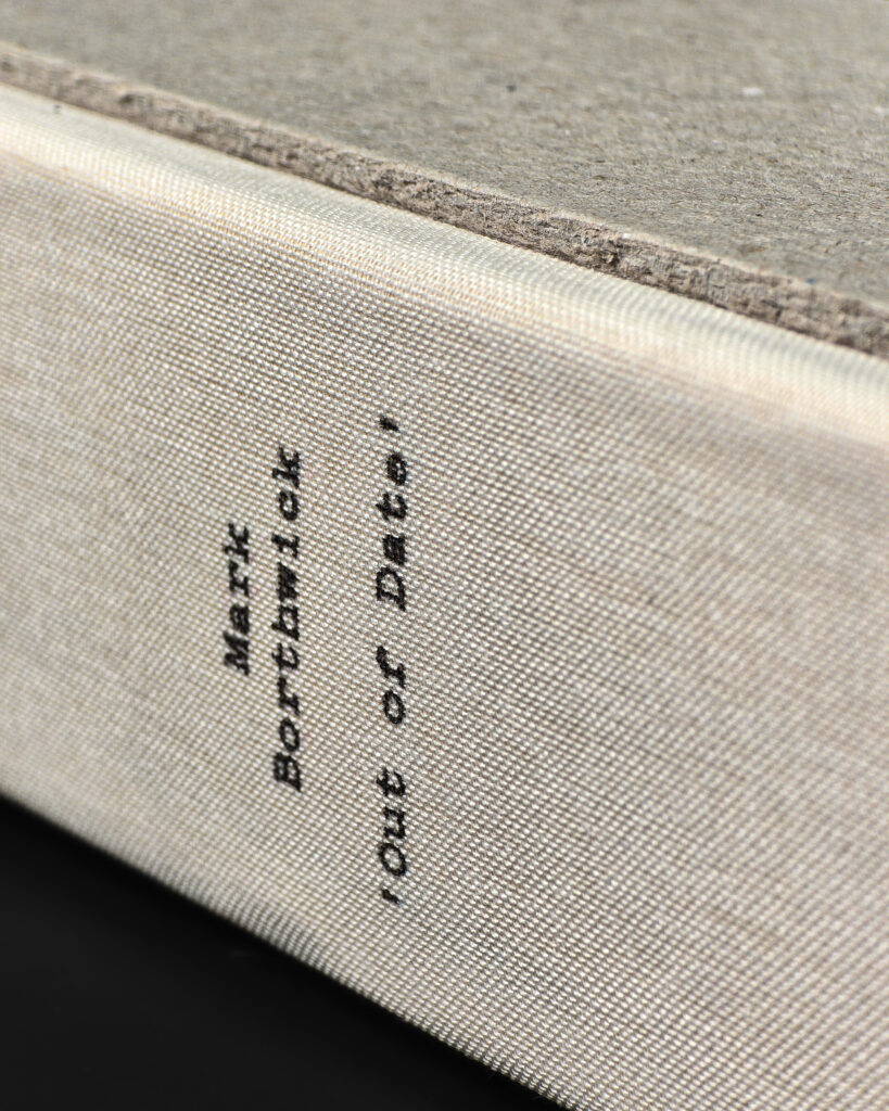 Close-up of the cloth spine and printed title on Mark Borthwick Out of Date: Pola Pan 1984–1996.