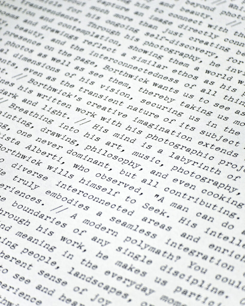 Close-up of typewritten-style text printed inside Mark Borthwick Out of Date.