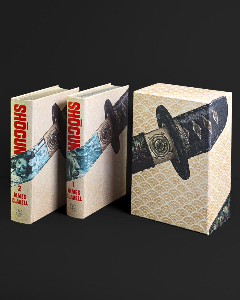 Two Shōgun volumes displayed beside their printed cloth slipcase, showing the coordinated illustrated design.