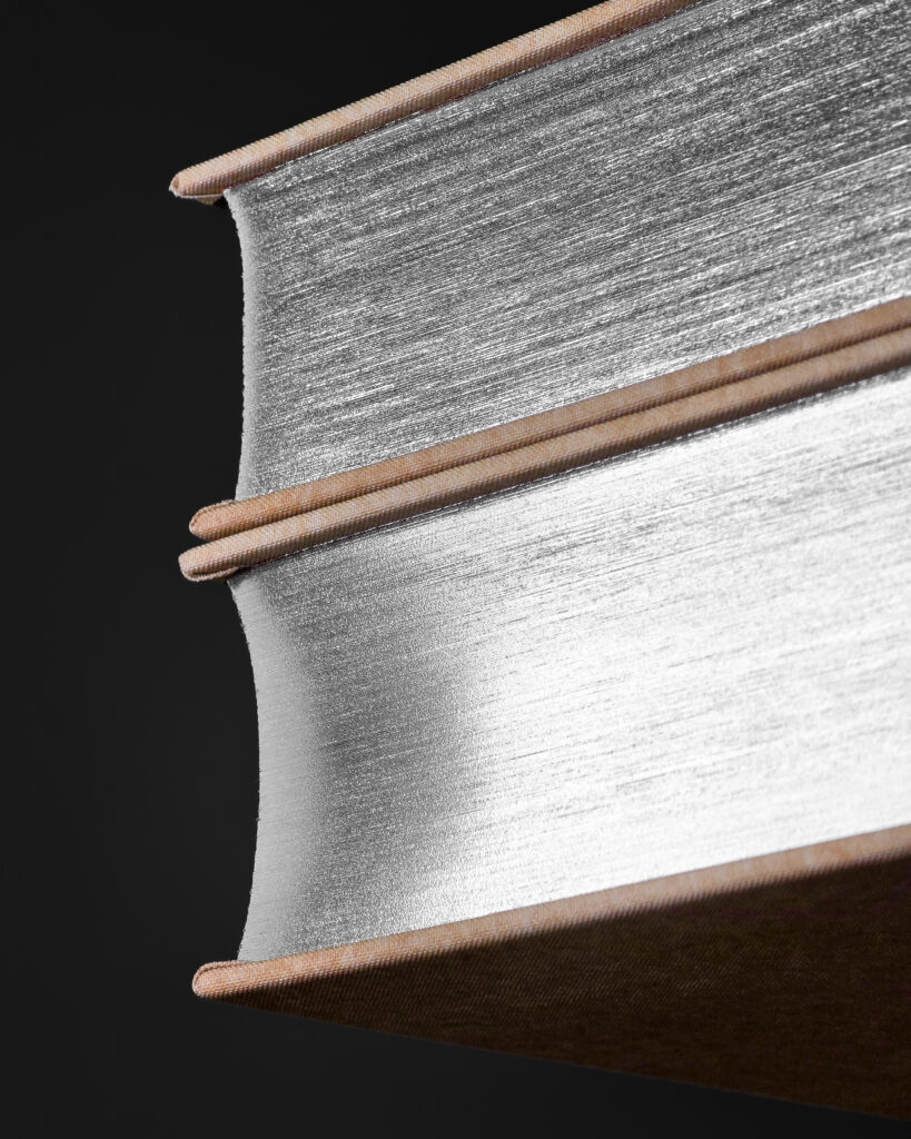 Close-up of the silver-finished top edges of the Shōgun volumes by The Folio Society