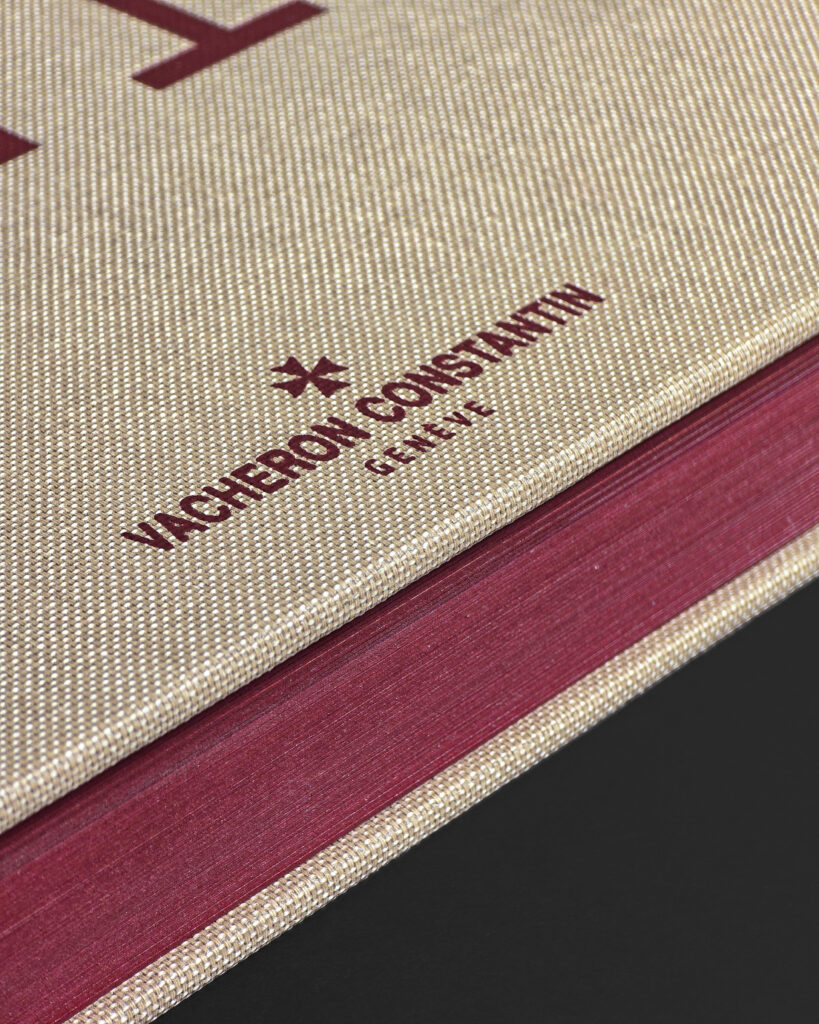 Close-up of the cloth cover and burgundy book edges of Vacheron Constantin: Time is Art.