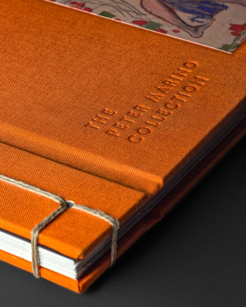 Detail of the orange cloth cover with Peter Marino Collection lettering on Vienna 1900.