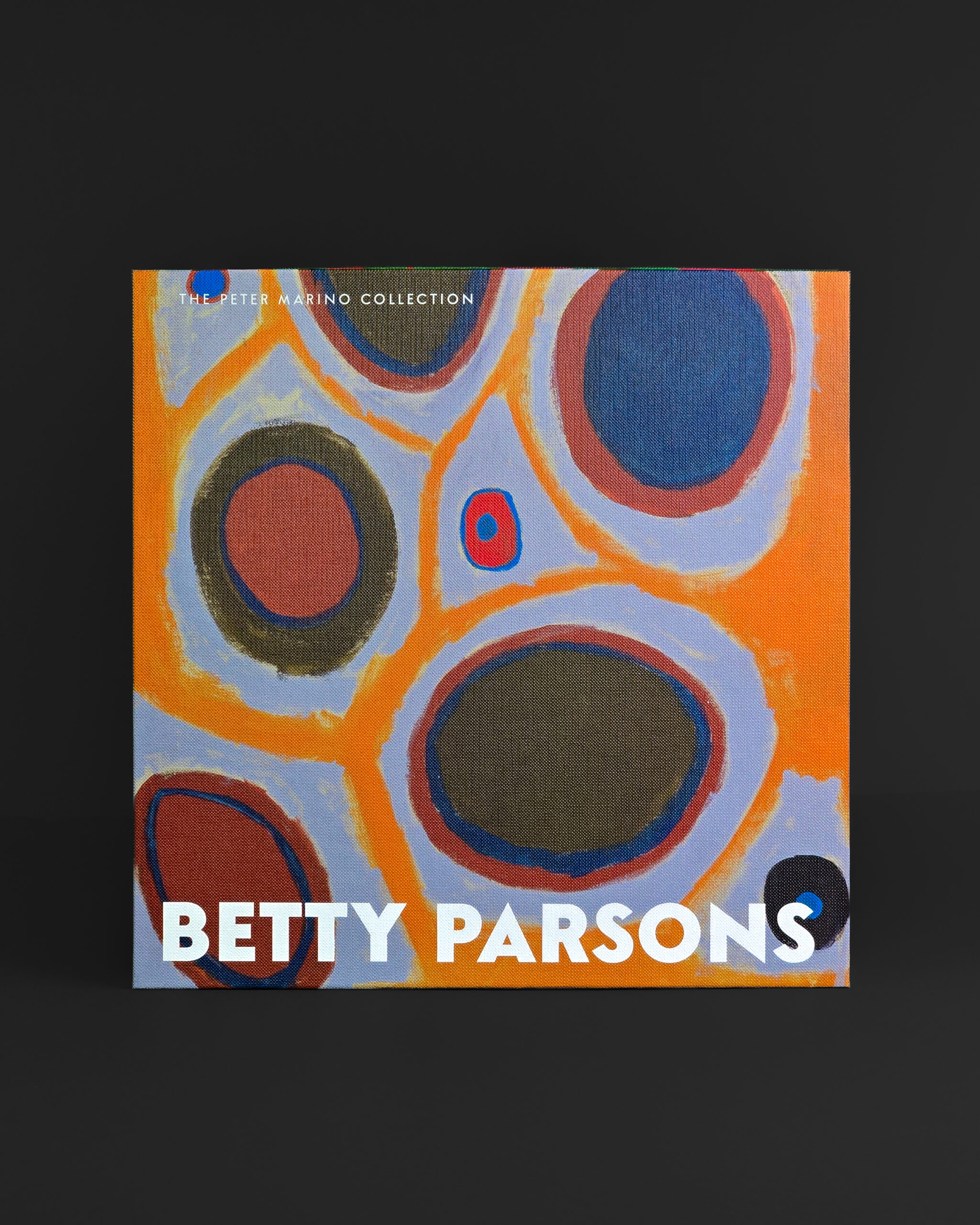 Betty Parsons cover of the Peter Marino Collection exhibition catalogue, featuring a colourful abstract artwork on the cloth-covered hard case.