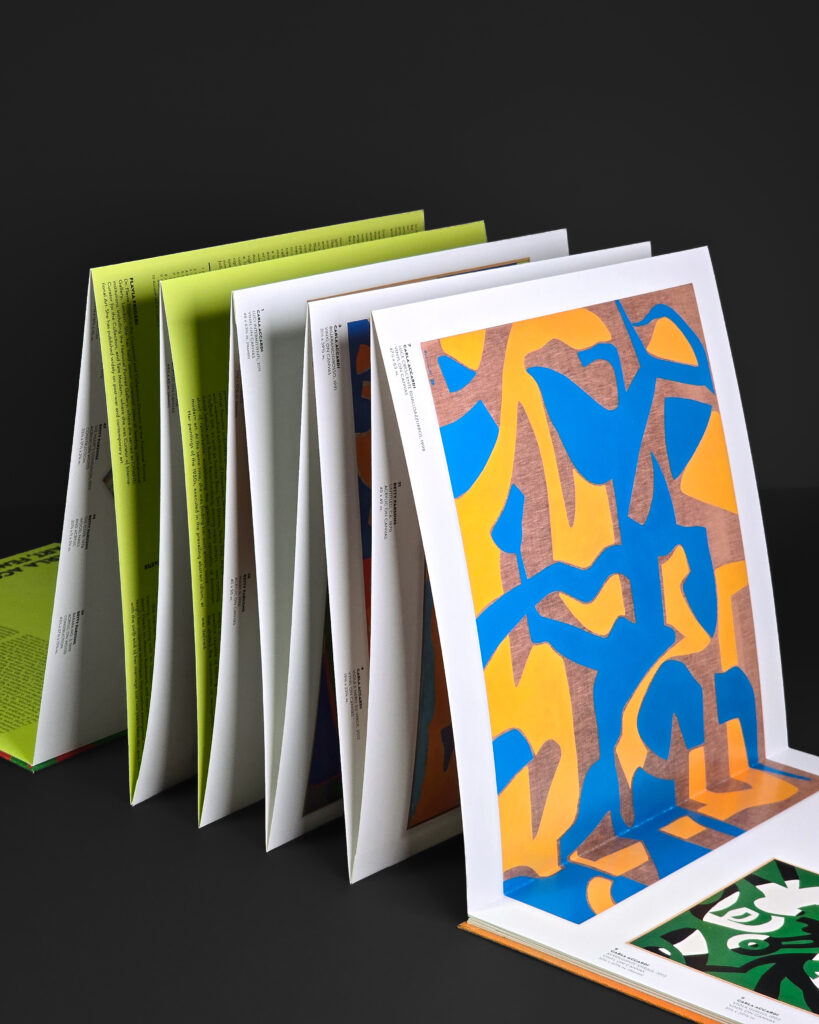 Side view of the unfolded Carla Accardi catalogue highlighting the alternating folds and sculptural concertina construction.