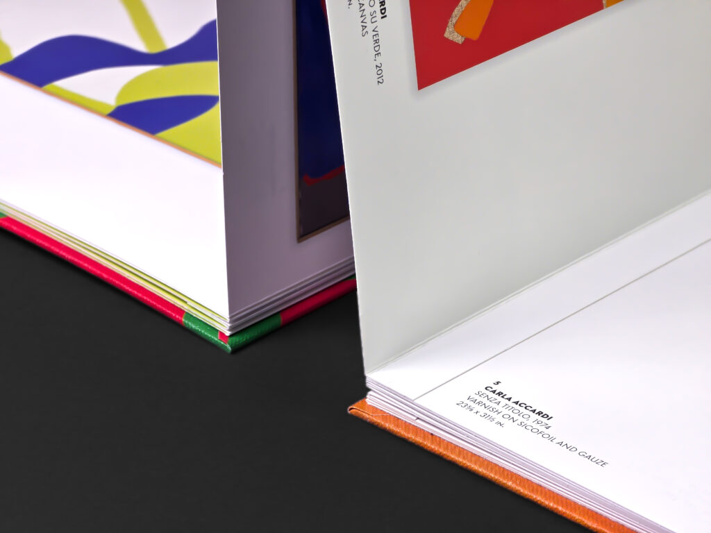 Close-up of the concertina construction showing the folded panels, hardcover edges and transition between printed sections.